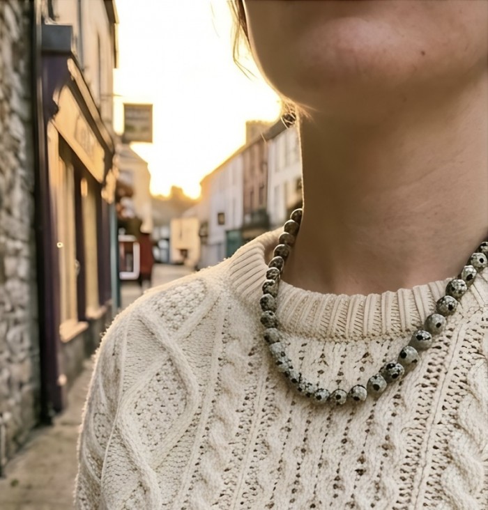 Nature Inspired genuine Dalmatian Jasper .925 Sterling Silver handmade necklace - Worn on neck, Dalmatian Jasper necklace with cable knit sweater backdrop.