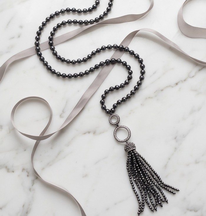 Boho Style Genuine Titanum Crystal .925 Sterling Silver handmade necklace 34 inches long - Boho style necklace on marble background, showcasing pendant and beads.