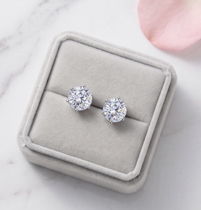 Veronica - 12.2 carat White Topaz rhodium over .925 Sterling Silver earrings, 10mm wide - Top view of Veronica White Topaz earrings in a gray jewelry box.
