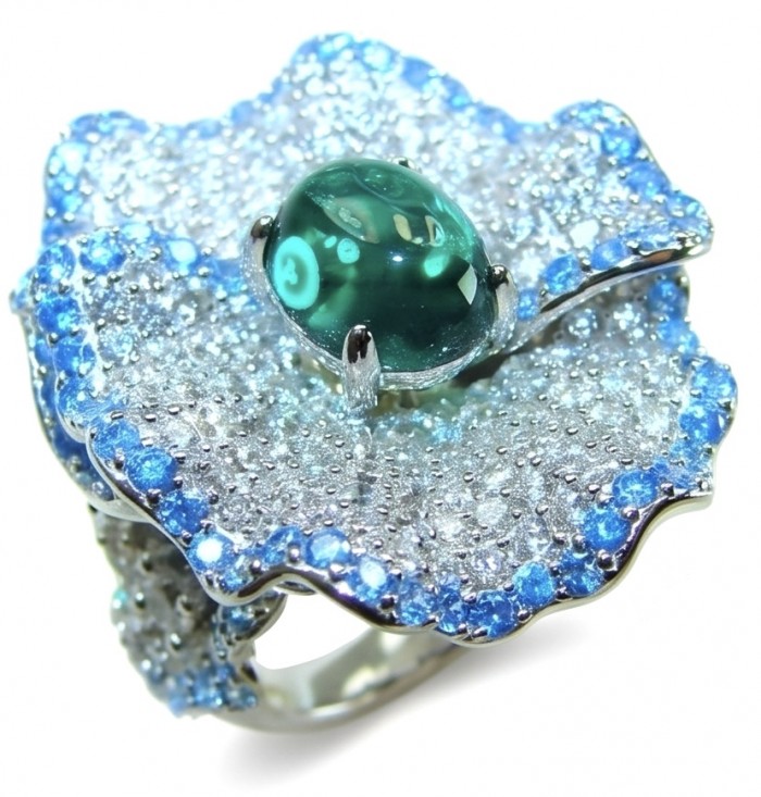 Exotica 5.2 carat natural Emerald rhodium over .925 Sterling Silver Perfectly handcrafted Ring s. 6 - Emerald ring close-up with blue and silver details.