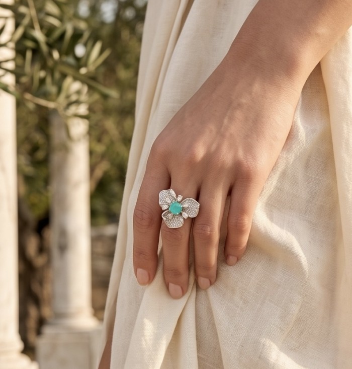 Elizabeth 4.8 carat Colombian Emerald 8.2 carat Moissanite .925 Sterling Silver dipped in Rhodium handcrafted Ring size 6 1/4 - Emerald and Moissanite ring worn on hand, outdoor background.