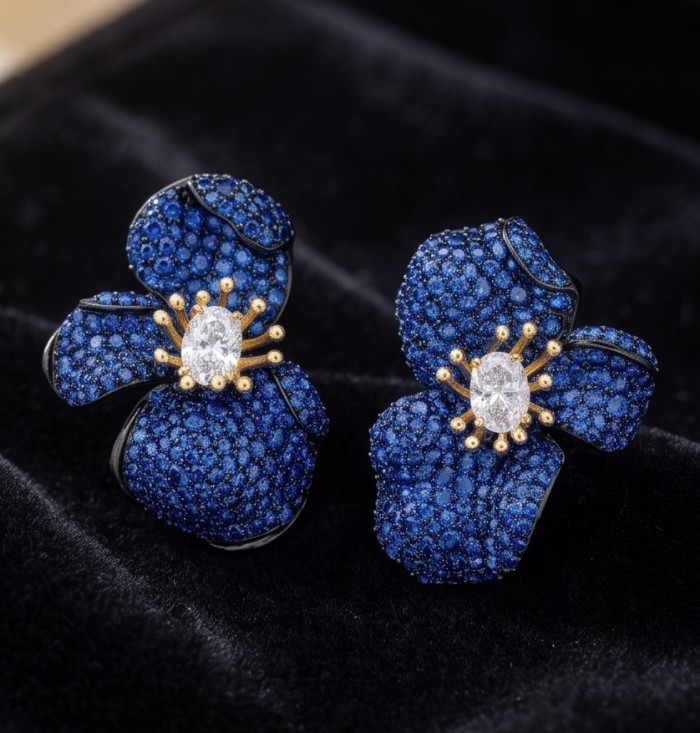 Amazonia - 38.8 carat pave Colombian Sapphire 2 tones .925 Sterling Silver handmade Statement Earrings - Close-up of flower-shaped Amazonia earrings with Colombian sapphire