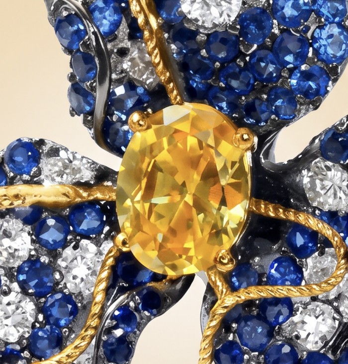 Exotica - real art - authentic 4.9 carat yellow Sapphire 9.2 carat pave Colombian Sapphire 2 tones .925 Sterling Silver dipped in black rhodium handcrafted earrings - Close-up of Exotica jewelry with yellow sapphire and blue gems.