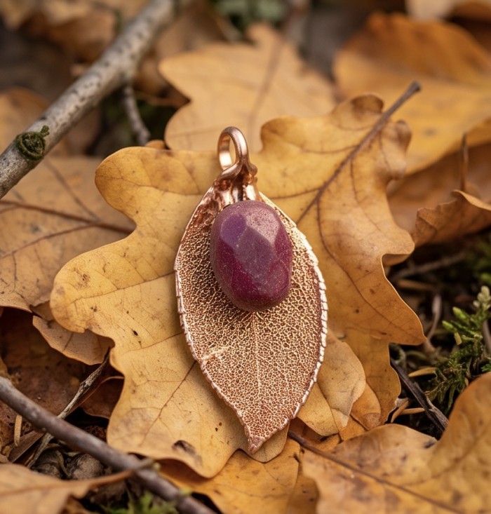 REAL Leaf dipped in copper Ruby stone & .925 Sterling Silver Pendant - Leaf copper pendant with ruby stone on autumn leaves, overhead view