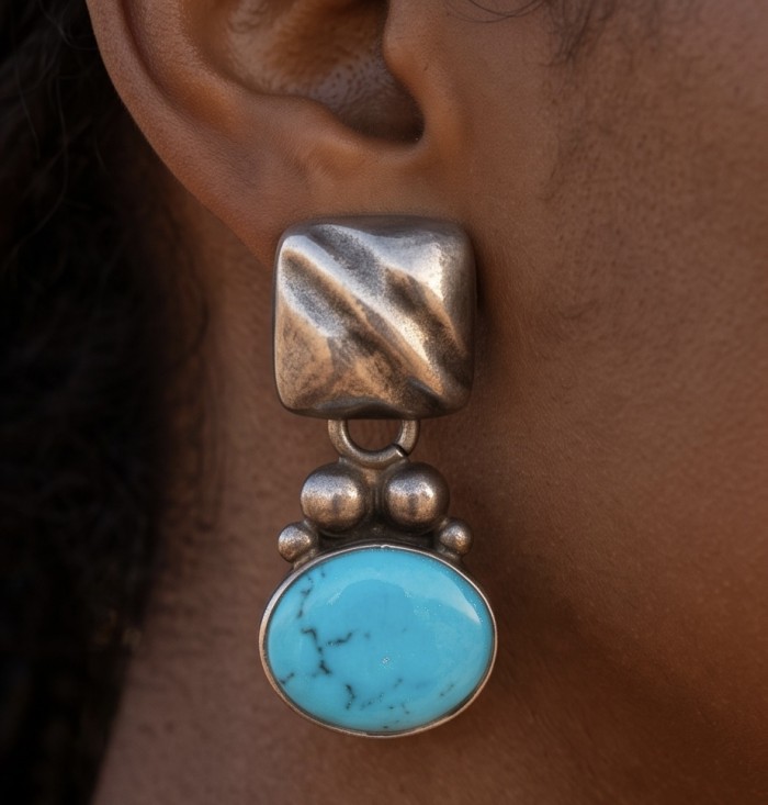 Native Spirit Great authentic Sleeping Beauty Turquoise .925 Sterling Silver handcrafted STATEMENT Earrings - Close-up of Native Spirit earring with turquoise stone, worn on ear.