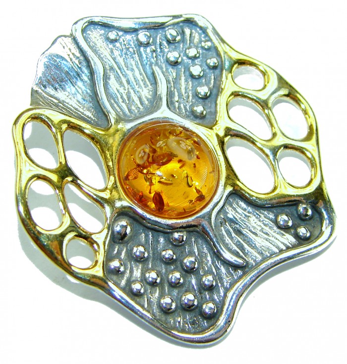 Prehistoric Authentic Baltic Amber 2 tones .925 Sterling Silver beautifully handcrafted Pendant - Amber and silver two-tone brooch with intricate design, top view.