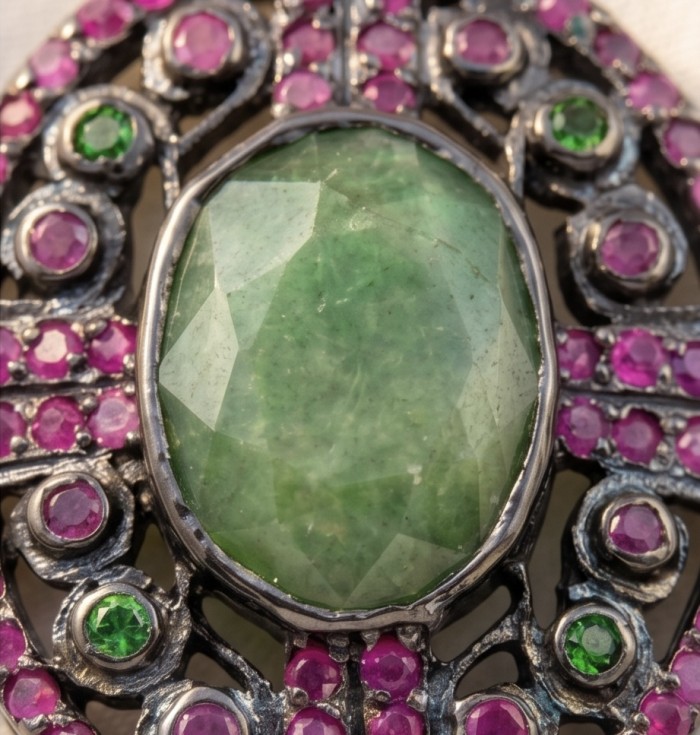 Brazilian Beauty 14.5ctw OVAL cut Brazilian Tourmaline black rhodium over .925 Sterling Silver handmade Pendant - Close-up of Brazilian tourmaline jewelry with pink and green stones.