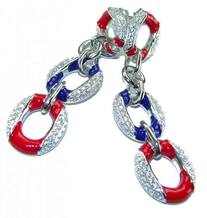 Independence - authentic 7.5 carat Ruby Sapphire .925 Sterling Silver handcrafted earrings - Close-up of silver, red, and blue linked jewelry with stone detailing.