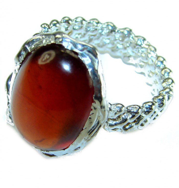 22.5 carat Red Garnet .925 Sterling Silver handcrafted ring; s. 8 - Close-up of a red garnet set in a textured sterling silver ring.