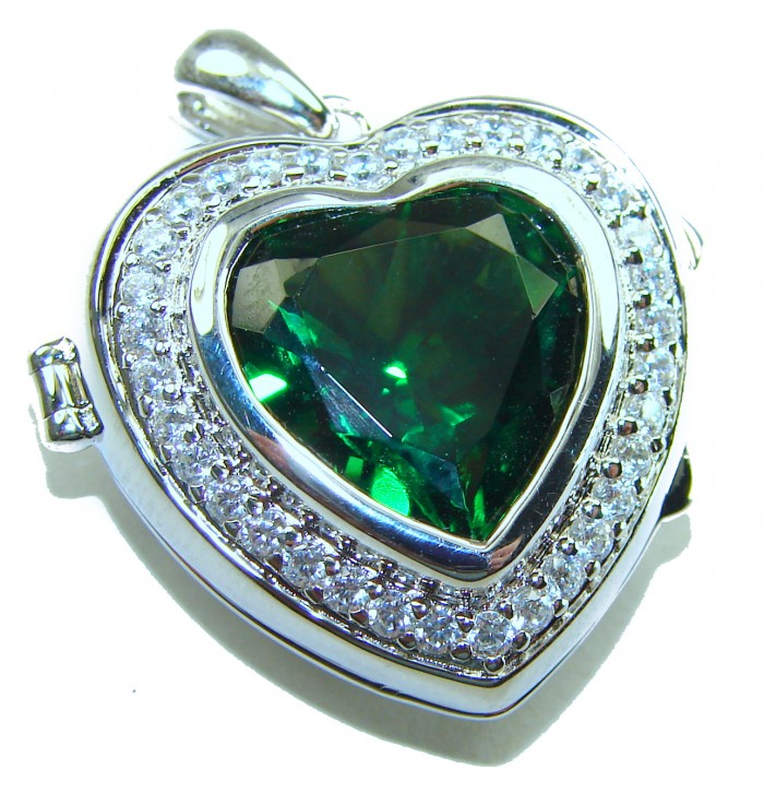 Secret compartment Authentic 18.5 carat Green Helenite .925 Sterling Silver Pendant - Close-up of heart-shaped green Helenite pendant with silver detailing.