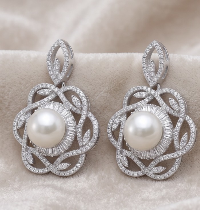 BLOOMING FLOWERS Genuine Pearl 0.2 CARAT lab grown Diamond rhodium over .925 Sterling Silver handcrafted Statement Earrings - Glamorous blooming flowers pearl earrings, front view on soft fabric.