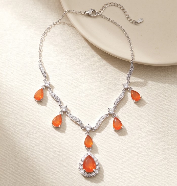 Unique 12.5 carat natural Mexican Fire Opal rhodium over .925 Sterling Silver brilliantly handcrafted necklace - Mexican Fire Opal necklace, top view showing teardrop stones and chain.