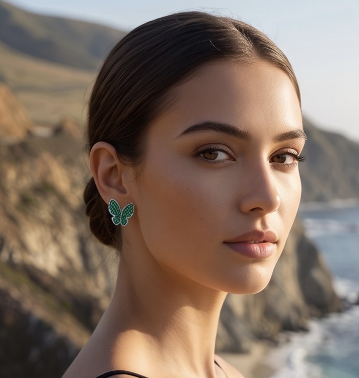 Incredible Butterflies genuine mystry setting 15.5 CARAT Emerald .925 Sterling Silver handcrafted Earrings - Side profile showing Incredible Butterflies earrings with green stones.