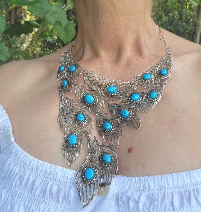 HUGE 102.9 grams Peacock Feather design genuine Turquoise .925 Sterling Silver handcrafted Necklace - Necklace with turquoise peacock feather design worn on neck.