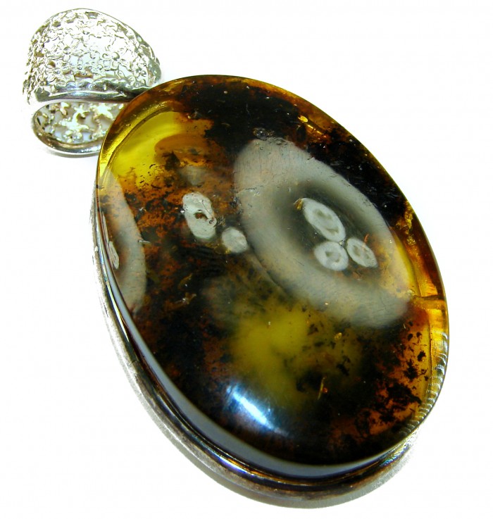 Prehistoric cognac Authentic Baltic Amber .925 Sterling Silver beautifully handcrafted Pendant - Close-up of Prehistoric Cognac Baltic Amber with Sterling Silver bale