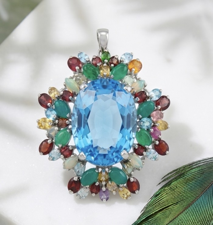 Oceania oval cut 47.8 carat Swiss Blue Topaz .925 Sterling Silver dipped in rhodium Handcrafted Pendant Brooch - Close-up of Oceania pendant with blue topaz and colorful gemstones.