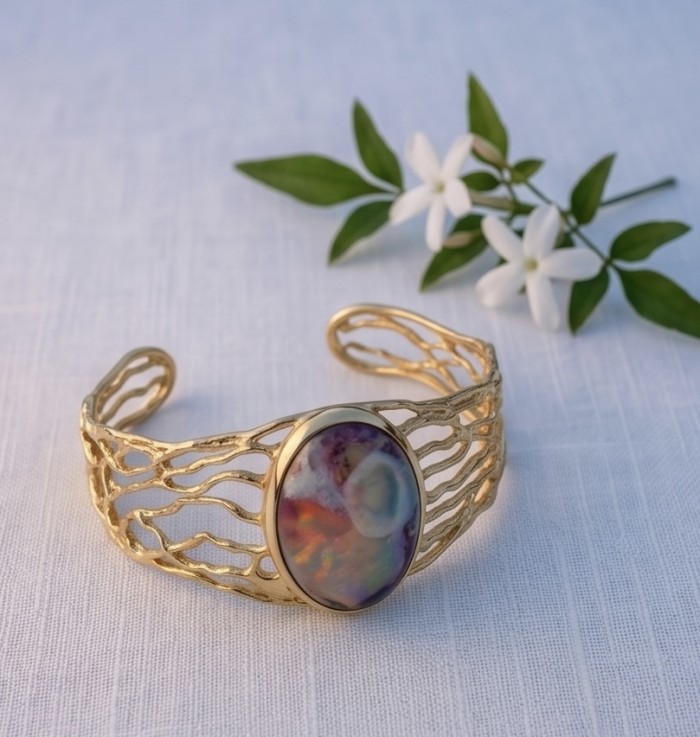 Authentic 25.8 carat Mexican Opal handmade 14K Gold over .925 Sterling Silver Bracelet / Cuff - Mexican Opal bracelet in 14K gold, top view with flowers in background