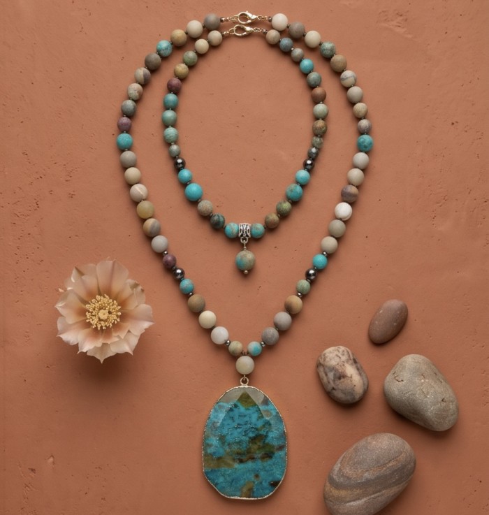Boho Style - Great quality Chrysocolla .925 Sterling Silver handcrafted Necklace - Boho style chrysocolla necklaces on terracotta background, top view.