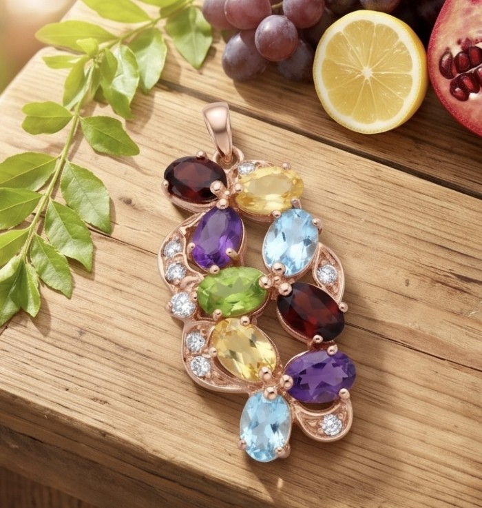 Divine Protection 14.8 carat Precious Multigem 14k gold over .925 Sterling Silver Pendant - Multigem pendant on wood, top view, with fruits and leaves around.