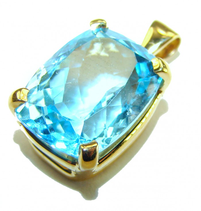 Atlantica baquette cut 10.9 carat Swiss Blue Topaz 18K Gold over .925 Sterling Silver Handcrafted Pendant - Close-up of blue topaz in 18K gold setting, angled view.
