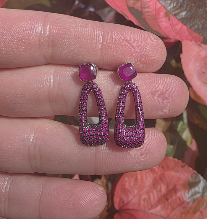 Bella Rossa - 2.5 carat pave Mozambique Ruby .925 Sterling Silver dipped in Rhodium handcrafted earrings - Mozambique ruby earrings held in hand, front view close-up.