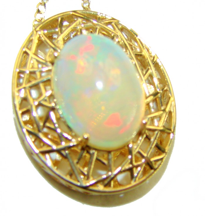 Earth Treasure Authentic 16.8 carat Golden Ethiopian Opal 22K Gold over .925 Sterling Silver handcrafted Statament Necklace - Close-up of golden Ethiopian opal pendant against a white background.
