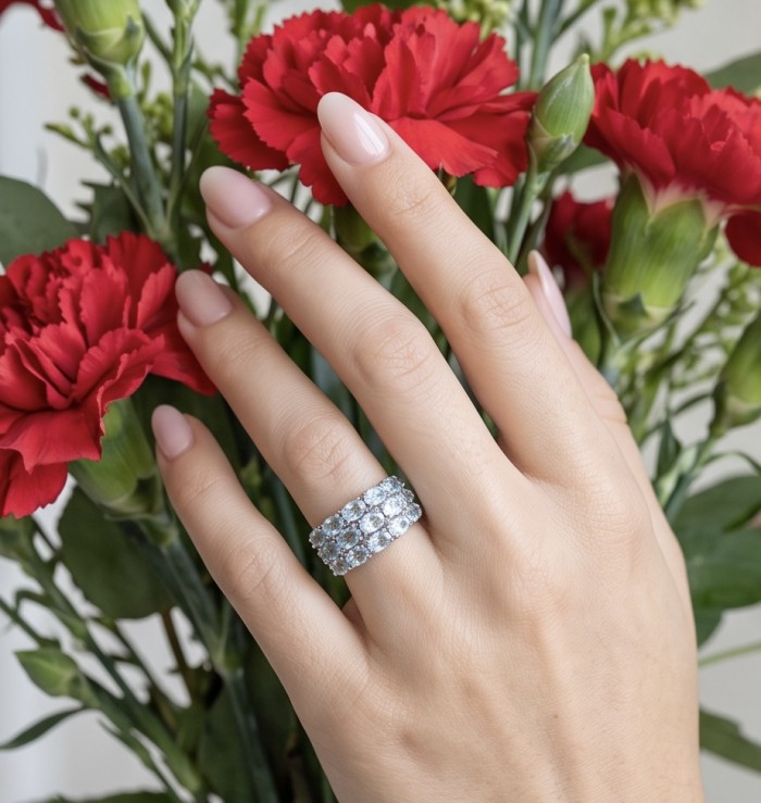 Blue Fantasy 10.3 carat Swiss Blue Topaz .925 Sterling Silver dipped in rhodium handcrafted ring size 7 1/4 - Ring worn on hand with red carnations in background