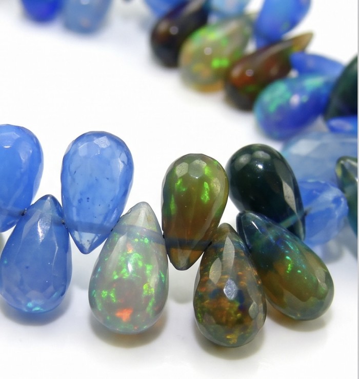 Sublime Brilliance Authentic Black Opal .925 Sterling Silver handcrafted bracelet - Close-up of faceted black opal beads with colorful play of light.