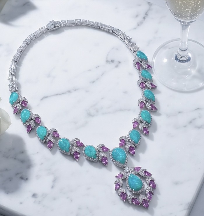 Wonderland 95.8 carat Paraiba Tourmaline rhodium over .925 Sterling Silver Handcrafted Statement necklace - Necklace with Paraiba tourmaline, top view on marble background