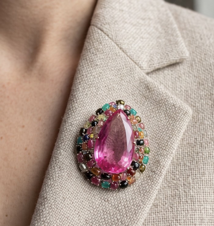 An exuberantly Large 69.8 grams Vintage style Pink Sapphire 44.2 Brazilian Tourmaline .925 Sterling Silver handmade LARGE Pendant - Brooch - Pink sapphire brooch close-up worn on beige fabric.