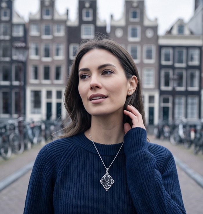 Vintage Beauty 9.7 carat Mozambique Sapphire Black Rhodium over .925 Sterling Silver handcrafted pendant - Woman wearing Vintage Beauty 9.7 carat Sapphire necklace in urban setting