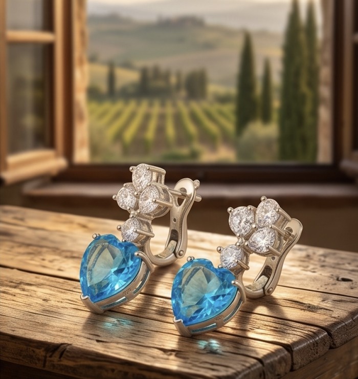 Angel's Heart - authentic 14.5 carat Swiss Blue Topaz rhodium over .925 Sterling Silver handcrafted Earrings - Side view of earrings with Swiss Blue Topaz and diamond accents.