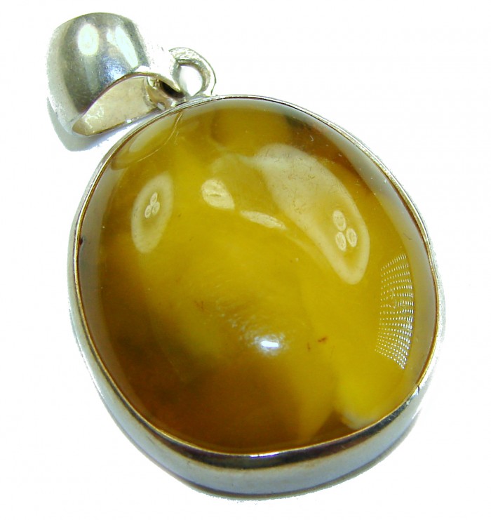 Prehistoric Authentic Baltic Amber .925 Sterling Silver beautifully handcrafted Pendant - Amber pendant in sterling silver setting, close-up view.