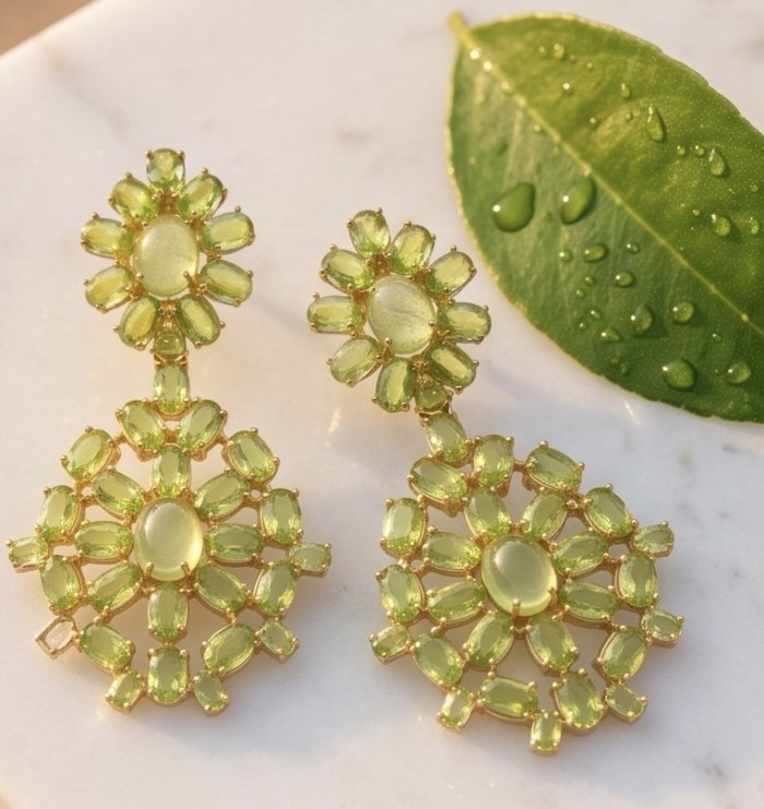 Alessia authentic 41.9 carat Brazilian Peridot 22K Gold over .925 Sterling Silver handmade Large Statement earrings - Close-up of Alessia 41.9 carat Brazilian Peridot earrings on marble surface.