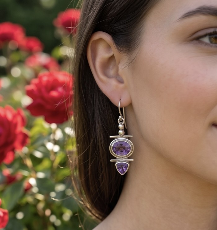 Natural 7.6 carat fancy Amethyst .925 Sterling Silver handmade earrings - Earring with amethyst worn on ear; red roses in background.