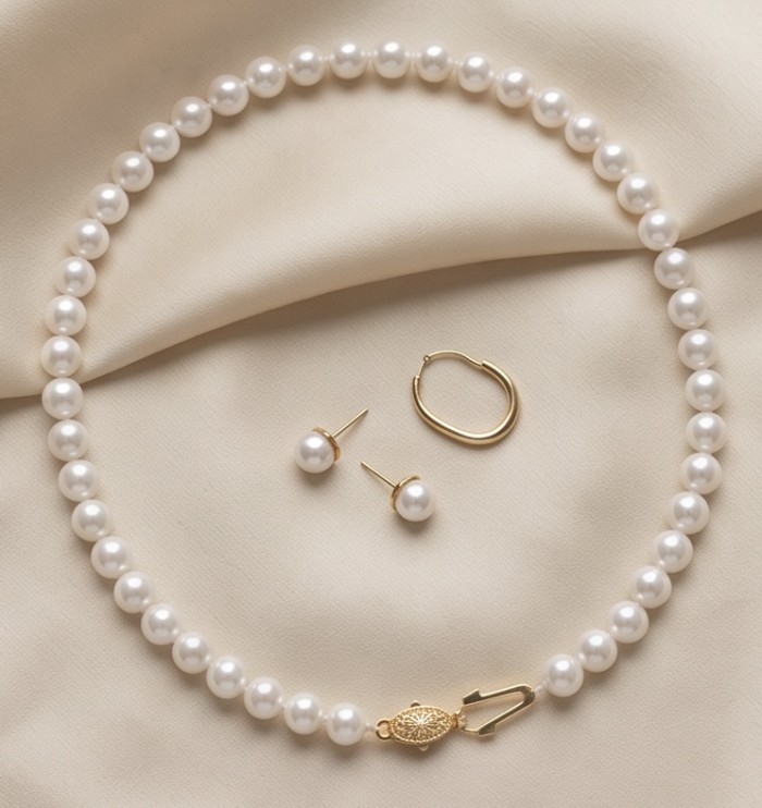Top quality Natural fresh water pearl 10K Gold over .925 Sterling Silver handcrafted necklace - Pearl necklace and earrings with 10K gold clasp detail on fabric background.