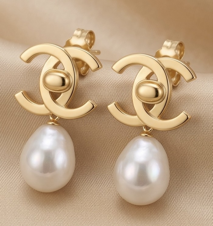 Classy Design - Genuine Pearl 14K Gold over .925 Sterling Silver handcrafted Statement Earrings - Gold and pearl earrings, front view on beige fabric background.