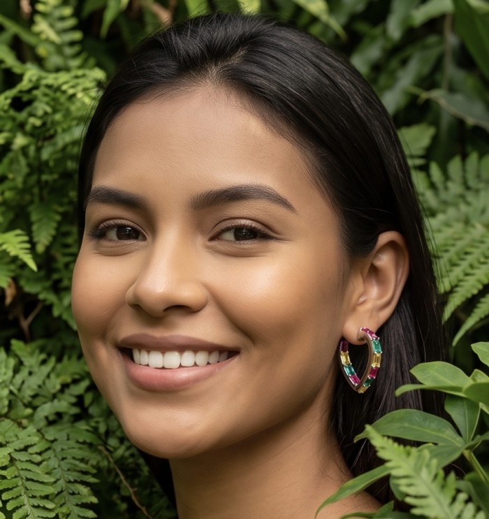 Luxurious 6.9 carat authentic Multigem .925 Sterling Silver dipped in Rhodium Handcrafted Statement Earrings - Earrings worn on woman amidst greenery, showcasing multigem design.