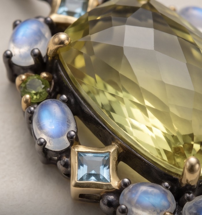 Perfection fancy emerald cut 30.3 carat Lemon Quartz black rhodium over .925 Sterling Silver handcrafted 2 tones pendant - Stone close-up of a 30.3 carat lemon quartz with surrounding gems.