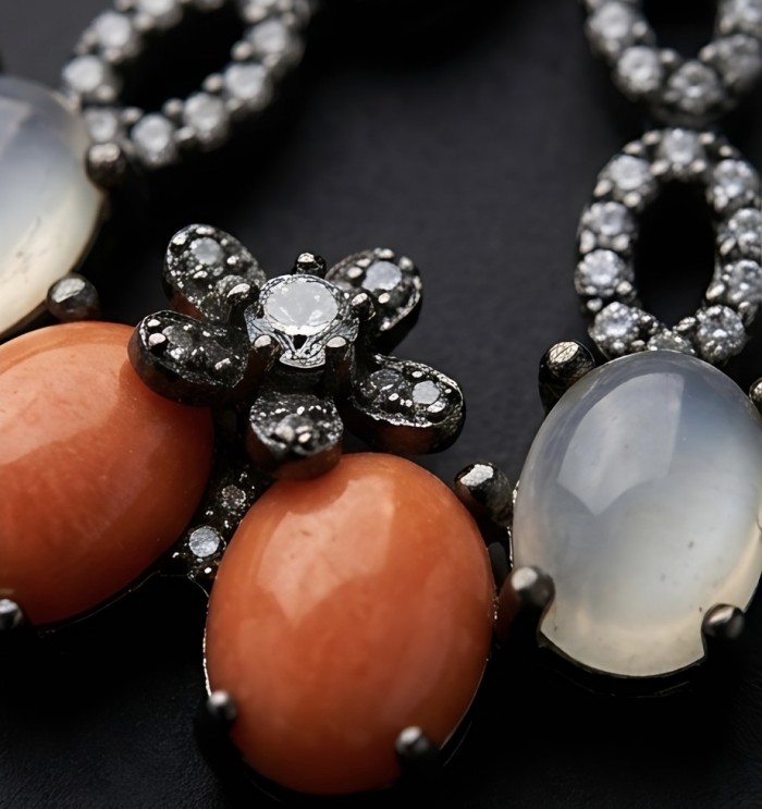 Queen of the Sea Genuine Orange Fossilized Coral black rhodium over .925 Sterling Silver handmade earrings - Close-up of orange fossilized coral and gem-studded jewelry piece