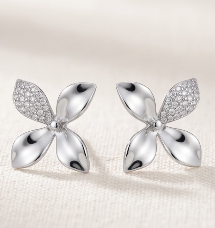 Authentic 0.5 CARAT natural pave White Topaz .925 Sterling Silver handcrafted earrings - Front view of sterling silver flower-shaped earrings with white topaz.