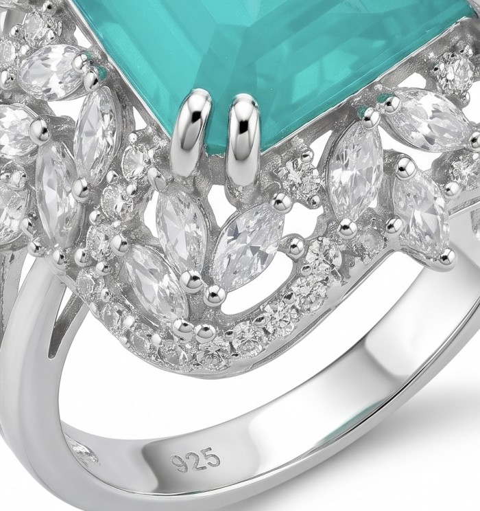 Elizabeth princess cut 14.8 carat Colombian Emerald 12.3 carat Moissanite .925 Sterling Silver dipped in Rhodium handcrafted Ring size 8 - Close-up of a ring with a Colombian emerald and silver detailing