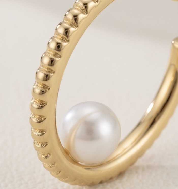 Baroque style Precious natural Pearl Gold over .925 Sterling Silver handcrafted earrings - Pearl detail on gold ring close-up, textured Baroque style