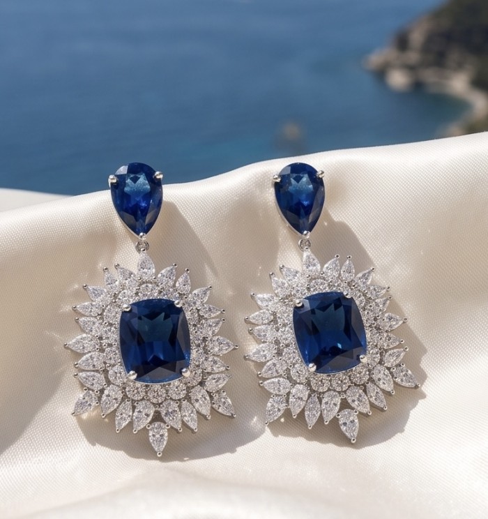 Giuseppina - Authentic 15.5 carat Amethyst Sapphire rhodium over .925 Sterling Silver handcrafted Statement earrings - Close-up of sapphire earrings with diamond accents on satin background.