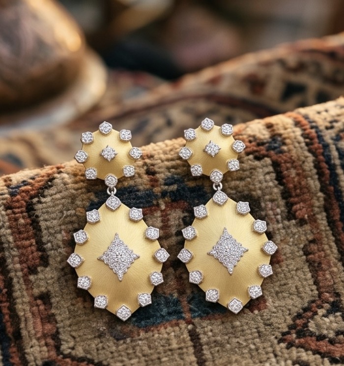 Byzantine Style White Topaz 14K Gold over .925 Sterling Silver handcrafted earrings - Byzantine style earrings, front view, on patterned fabric background.