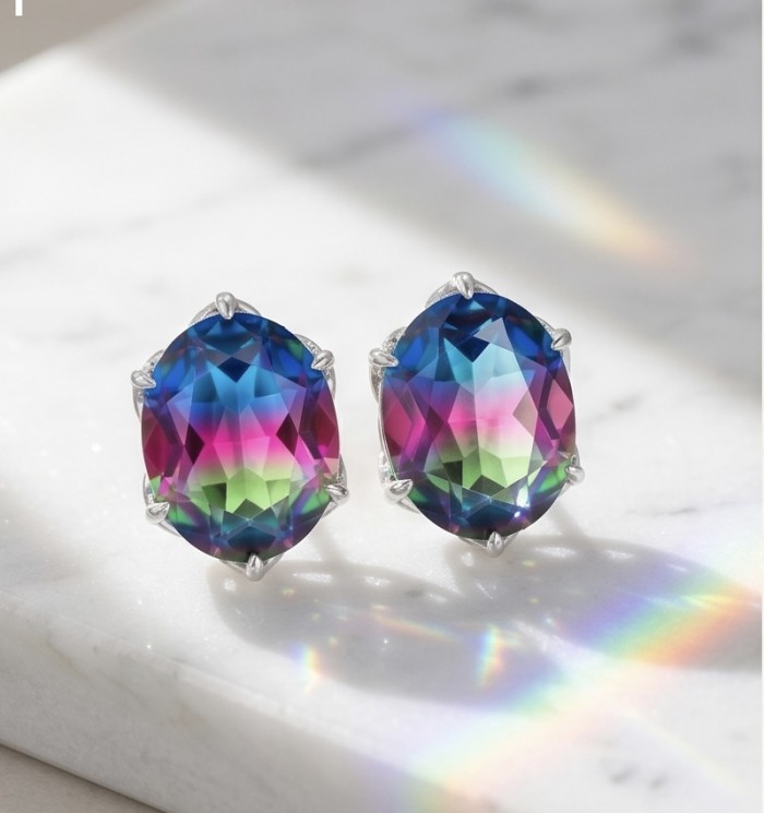 Luxurious authentic 11.2 carat Brazilian Tourmaline .925 Sterling Silver handcrafted earrings - Close-up of luxurious Brazilian tourmaline earrings on marble surface