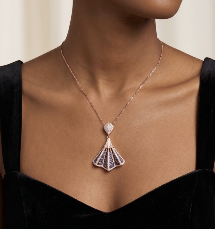 Luxurious 5.2 carat Sapphire .925 Sterling Silver dipped in 18K Rose Gold handmade Pendant - Necklace worn, close-up of pendant on model in black dress.