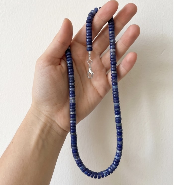 Boho Style 55.2 carat Lapis Lazuli .925 Sterling Silver handmade necklace - Hand holding Lapis Lazuli boho necklace with sterling silver clasp.