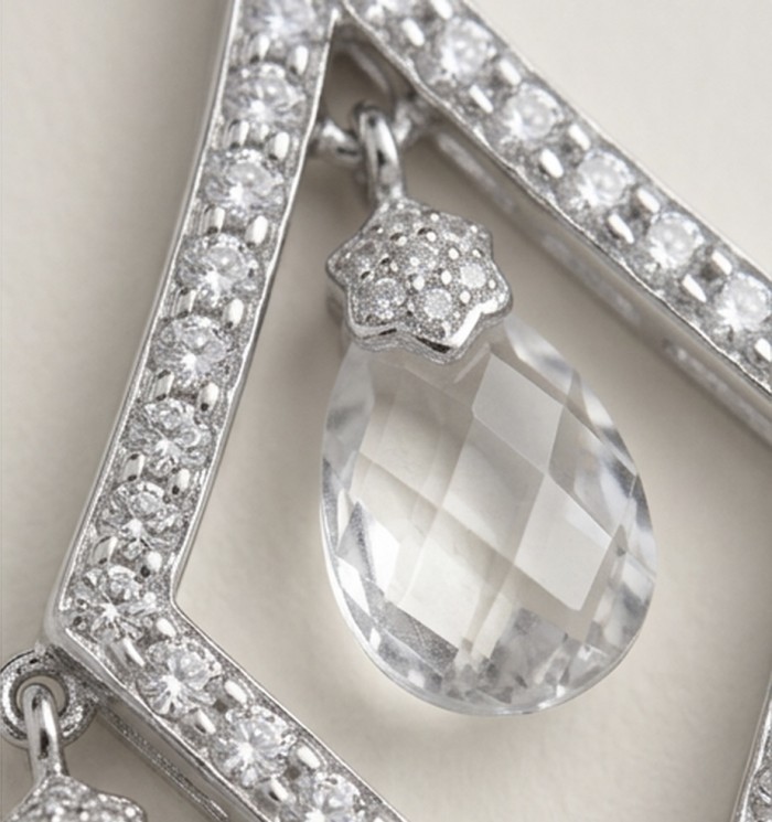 Luxurious 11.4 carat White Topaz .925 Sterling Silver handcrafted pendant - Close-up of white topaz and silver detailing on luxurious jewelry piece.