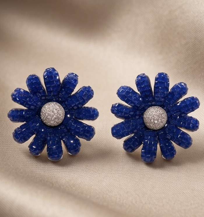 Blue Flowers - 10.8 carat mystery setting Sapphire .925 Sterling Silver handmade Statement Earrings - Front view of blue sapphire flower earrings on beige fabric.